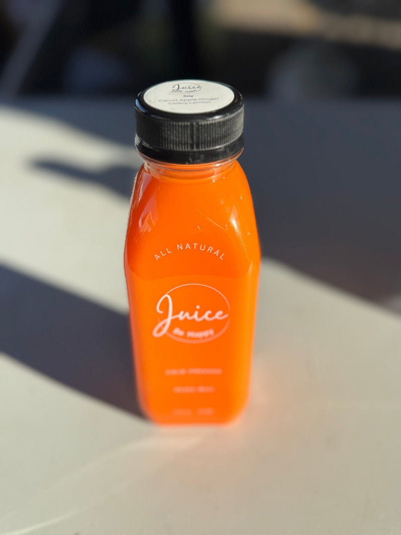 Juice Be Happy Joy blend cold pressed carrot, ginger, apple, and lemon juice in a glass bottle for digestion and immune health.