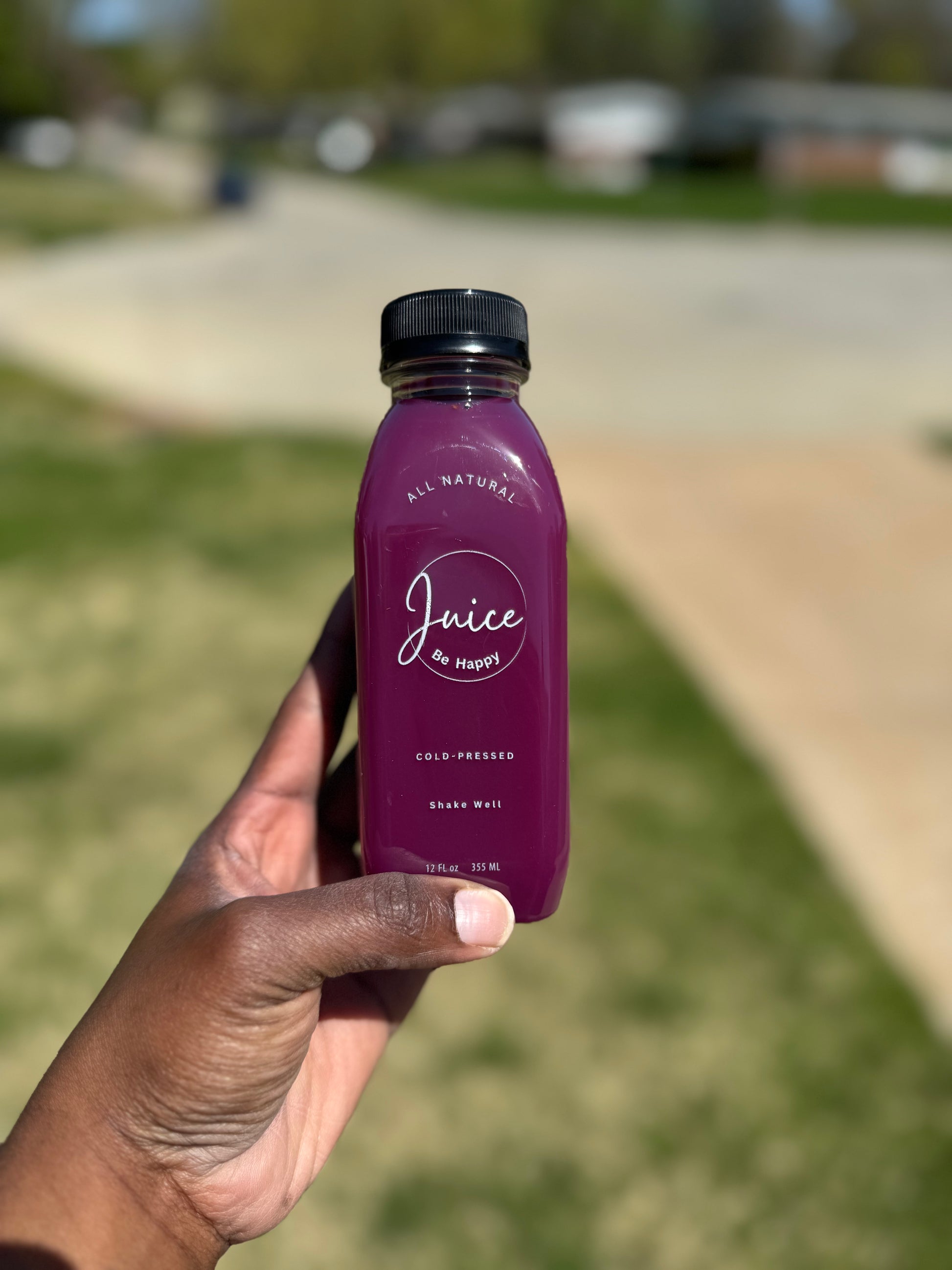 Juice Be Happy Kindness blend  cold pressed purple cabbage, apple, and ginger juice in a glass bottle rich in antioxidants and gut support.