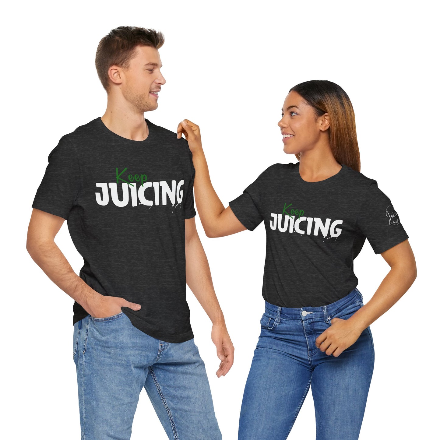 Two people wearing black t-shirts with 'Keep Juicing' text, standing close together on a white background.